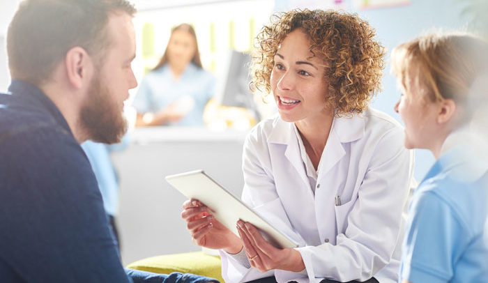medical practitioner explaining disability insurance to patient